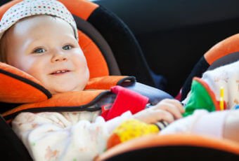Baby in child safety seat