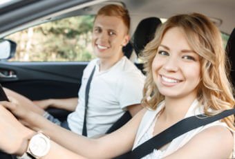 Young couple in their car