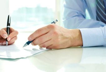 Independent insurance agent reviewing coverage with new client