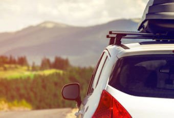 Family in their car heading out on vacation