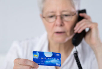 Lady on phone with credit card