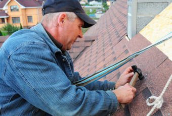Roofing contractor working on a roof