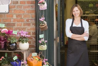 small business owner in front of flower shop